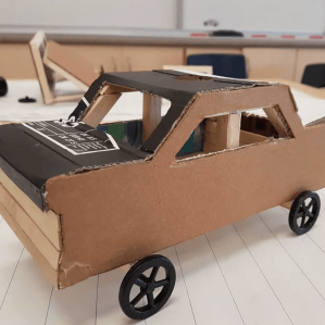 Cardboard car made in after-school art class in needham, ma